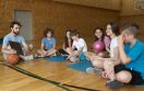 full-shot-kids-teacher-sitting