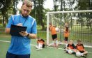 football-trainer-teaching-his-pupils