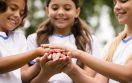 smiley-kids-putting-their-hands-each-other