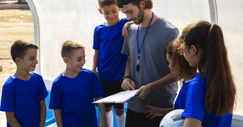 trainer-talking-players-side-view